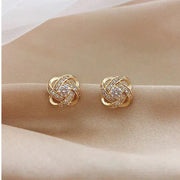 Boucles d'oreilles en cristal en forme de fleur en spirale dorée