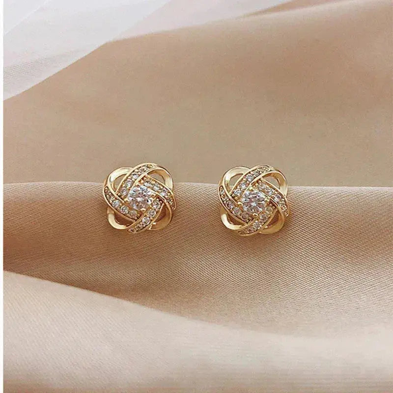 Boucles d'oreilles en cristal en forme de fleur en spirale dorée