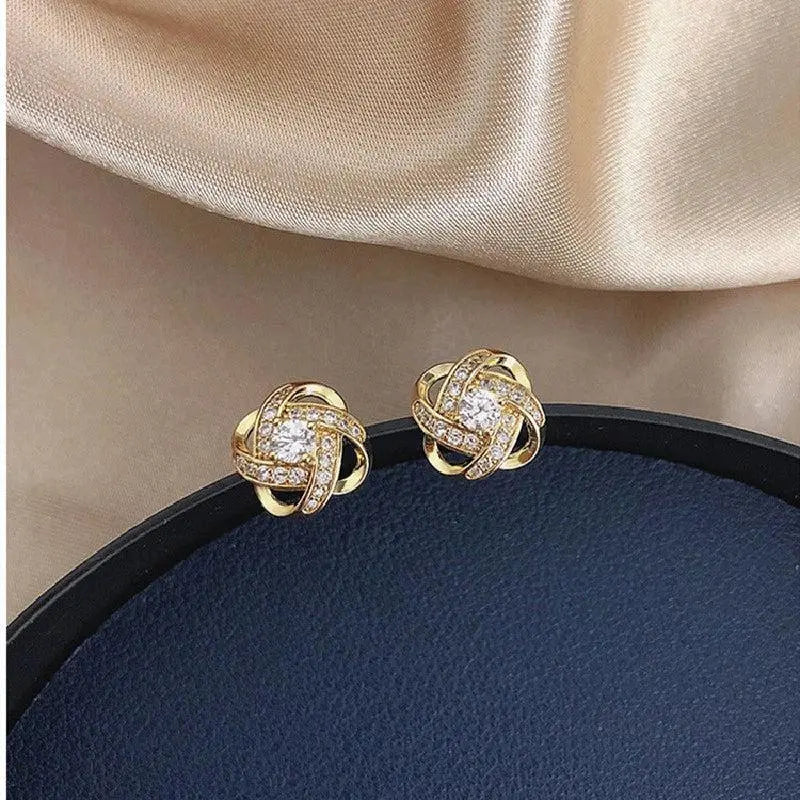 Boucles d'oreilles en cristal en forme de fleur en spirale dorée