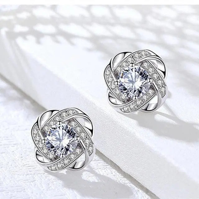 Boucles d'oreilles en cristal en forme de fleur en spirale dorée
