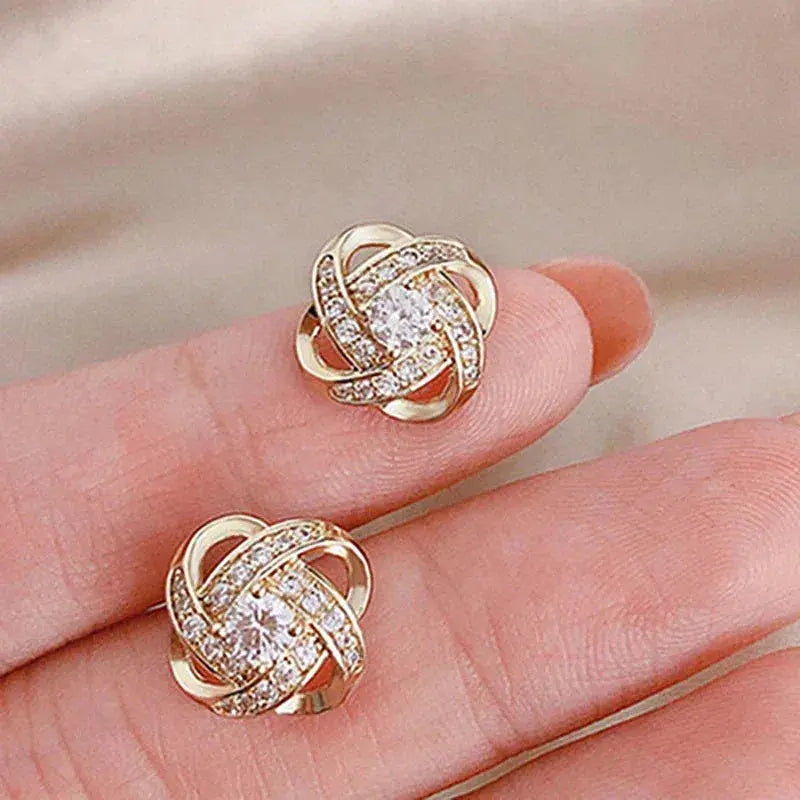 Boucles d'oreilles en cristal en forme de fleur en spirale dorée